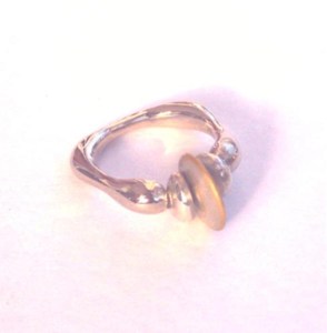 White gold ring inlaid with yellow spiral, by Pamela Dickinson
